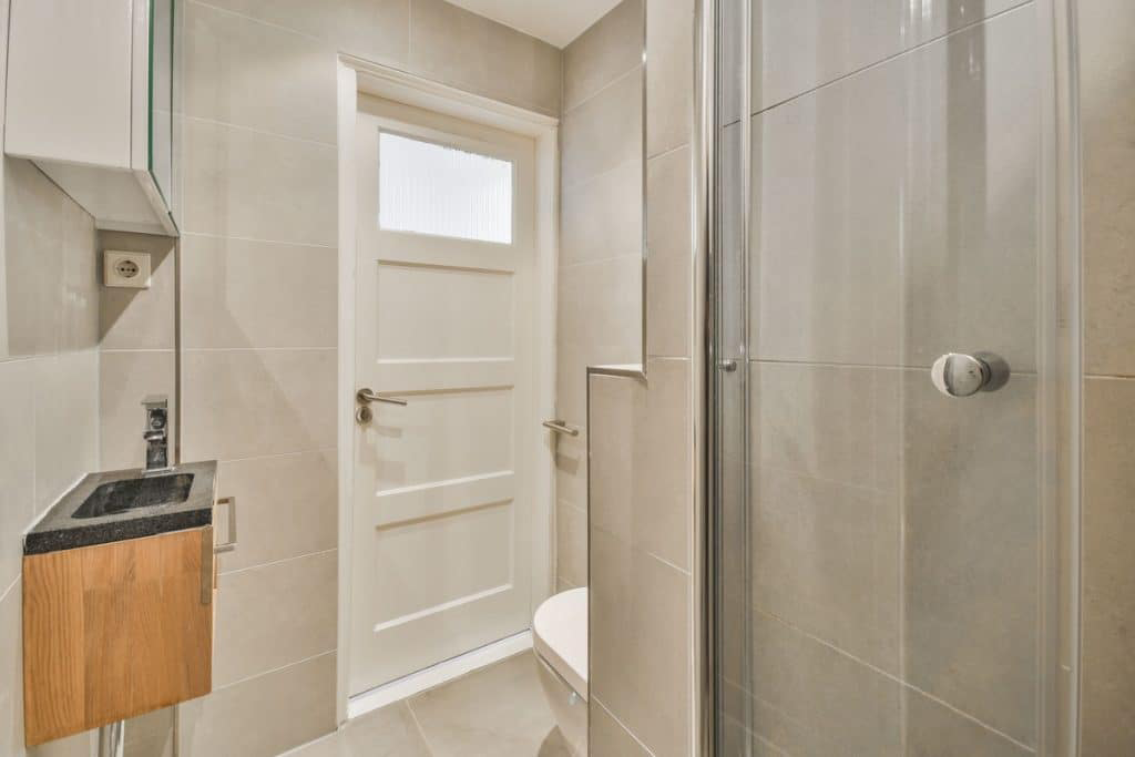 Close-up of a luxury bathroom door with a smooth, polished surface.