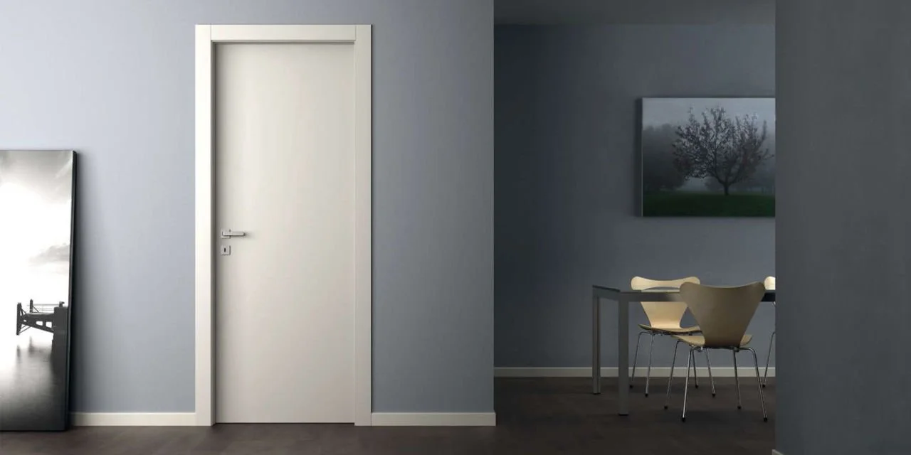 Luxurious black lacquered door complementing a chic modern hallway design.