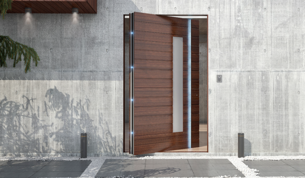 Oversized pivot door with a bronze finish, making a grand and inviting statement for a luxury villa.