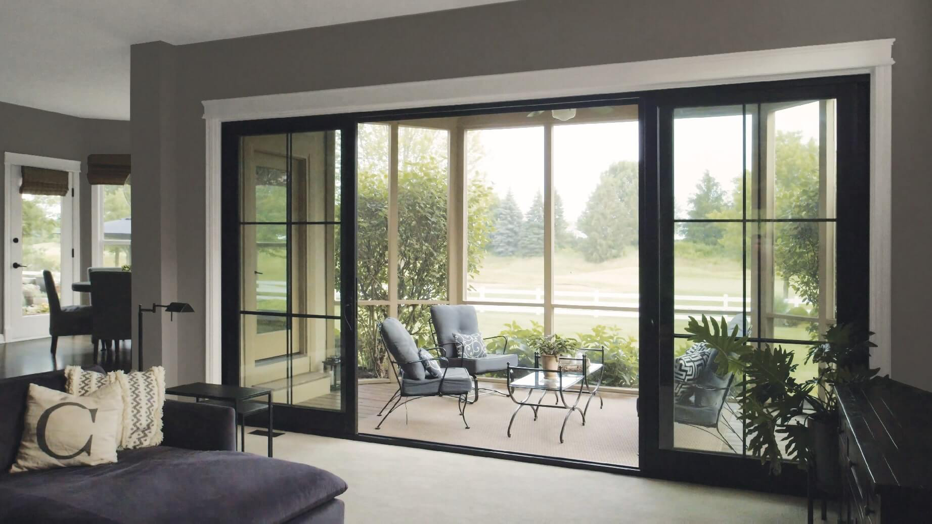Stylish sliding door with wood finish, adding warmth and sophistication to a modern bedroom.