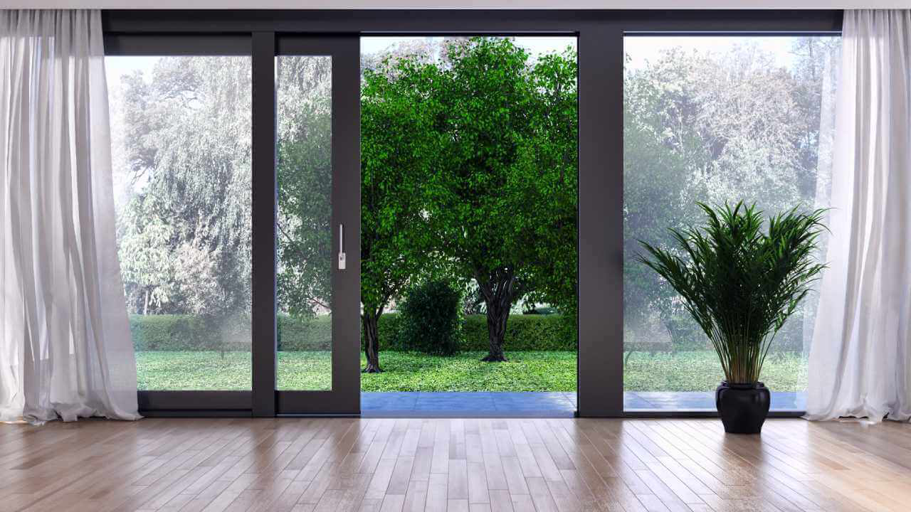 Glass sliding door leading to a spacious balcony, offering seamless access to outdoor living spaces.