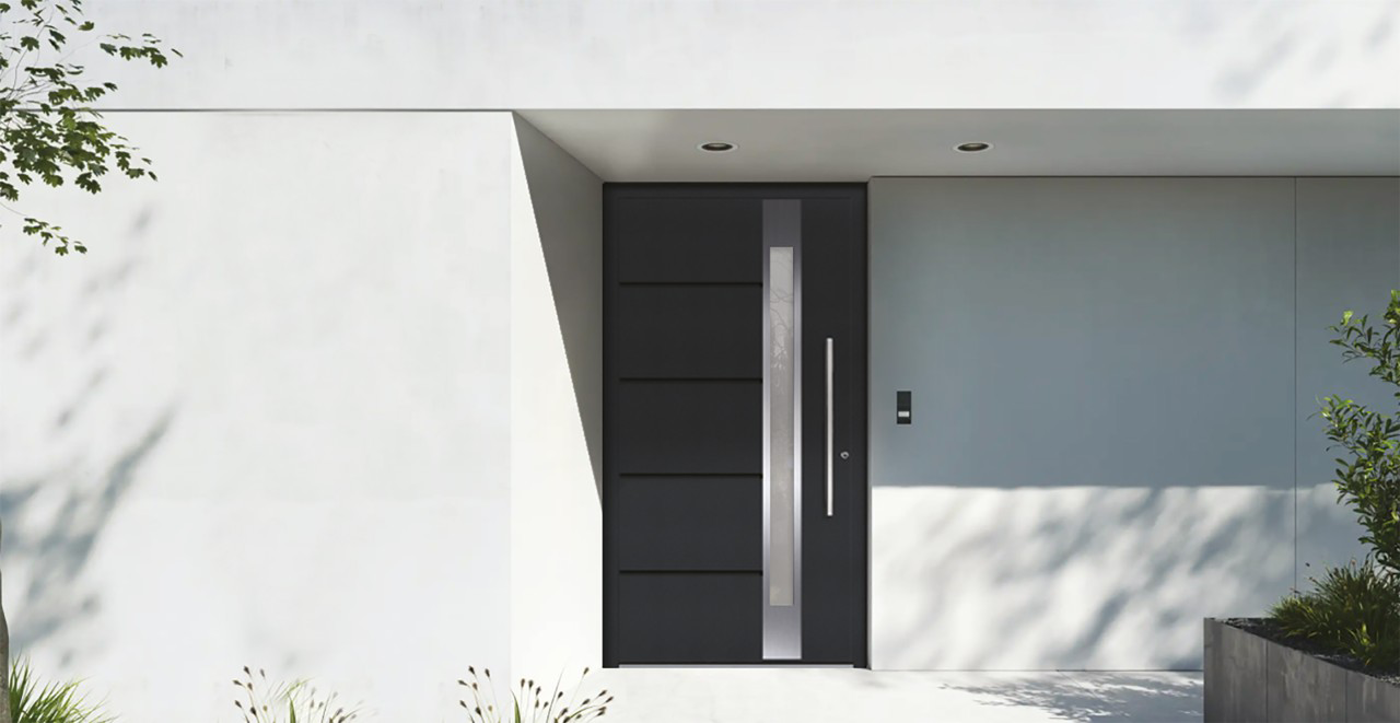 Double cast aluminum doors with symmetrical patterns, creating an inviting and elegant entry for a large home.