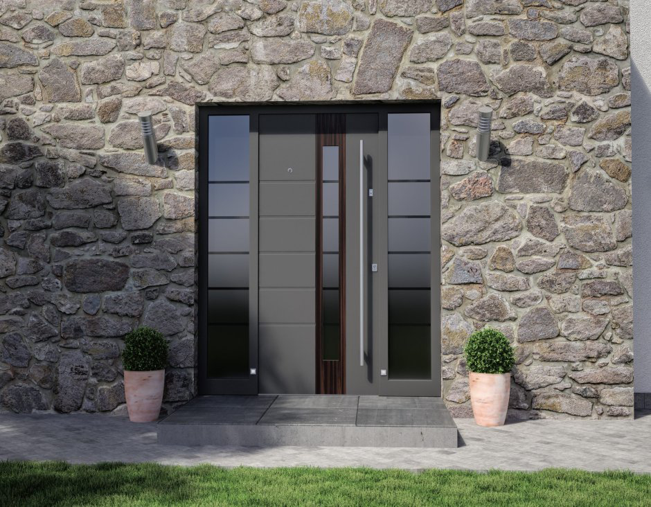 Front view of a cast aluminum door featuring a classic arched frame and ornate detailing.