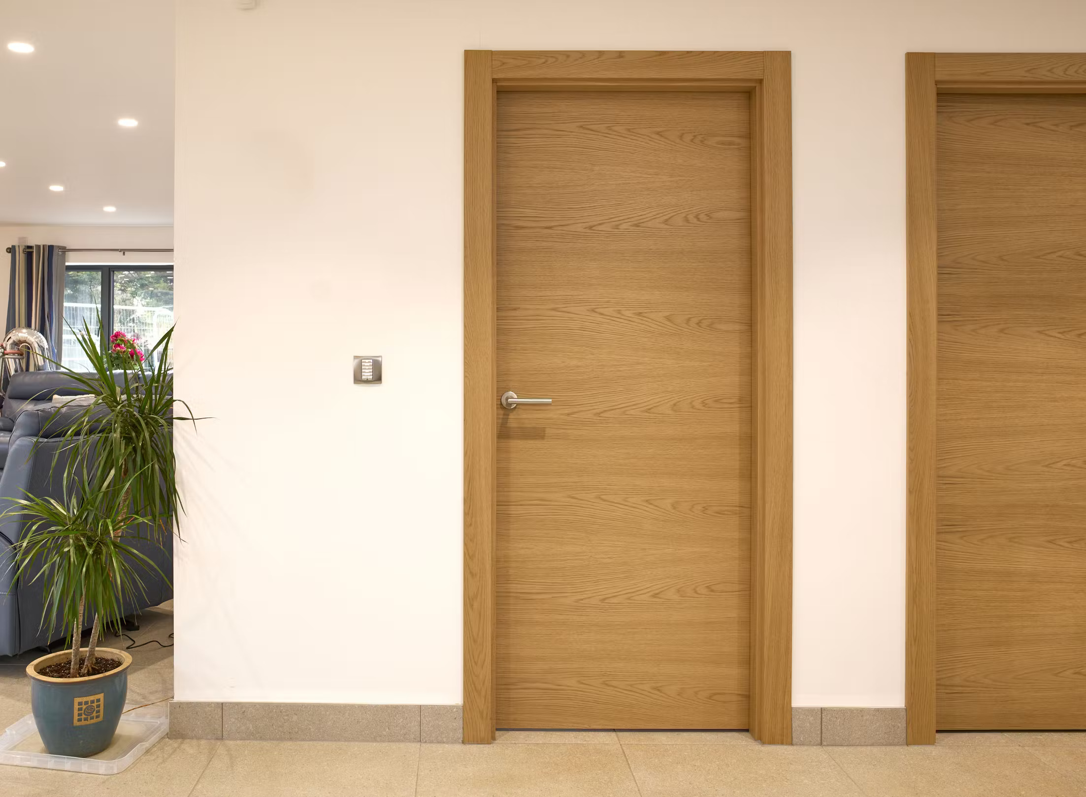 Close-up of a certified wood fire door with a sleek finish, ideal for apartment buildings.